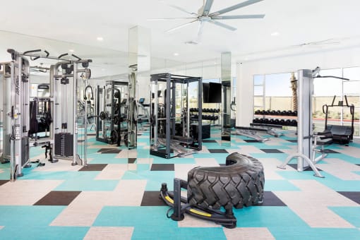 Fitness center at Rivue with a cable machine and squat rack at our apartments in Chula Vista San Diego.
