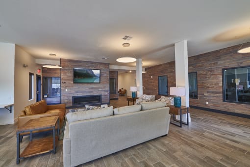 Clubhouse seating area in front of  TV and fire place at Alpine Vista, Colorado Springs