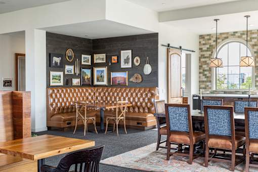 A dining room with a wooden table and chairs.