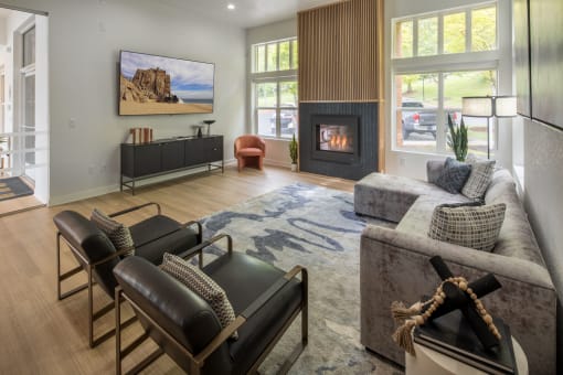 a living room with a couch and chairs and a fireplace at Arbor Heights, Tigard, Oregon