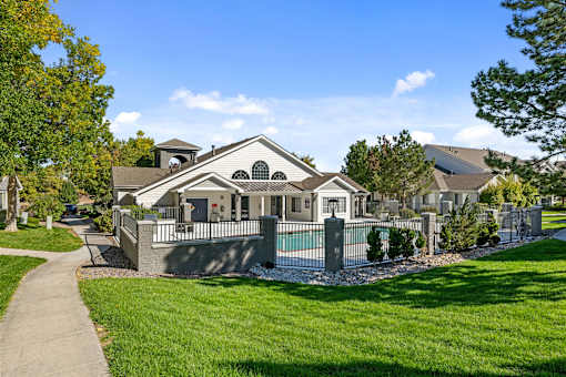 A large house with a pool in the backyard.