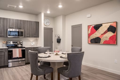 Modern kitchen with a dining table set for two.