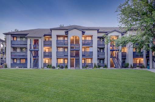 A large apartment complex with multiple balconies and staircases.
