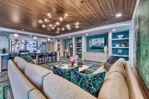 A living room with a large couch and a coffee table.