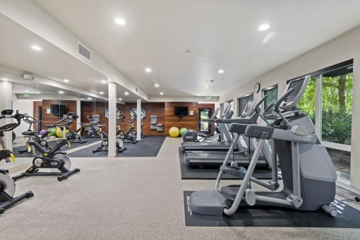 a gym with treadmills and other exercise equipment at Allez, Washington, 98052
