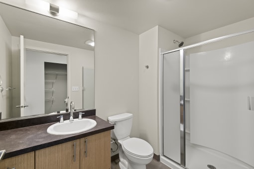 a bathroom with a toilet sink and shower at Allez, Redmond, Washington