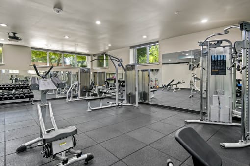 a fully equipped gym with weights machines and other exercise equipment at Allez, Redmond, Washington