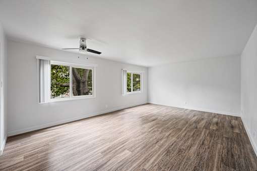 A room with wooden flooring and a ceiling fan at Hillsdale Garden Apartments, CA 94403