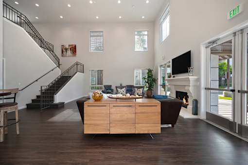 A living room with a staircase and a couch.