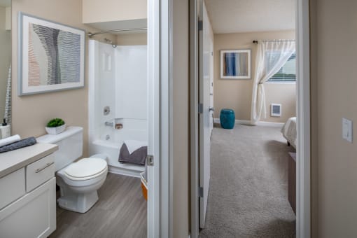 Bathroom with a toilet and a bath tub and a shower at Summerfield, Tigard