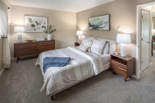 Bedroom with a bed and two nightstands and a closet at Summerfield, Tigard, OR, 97224