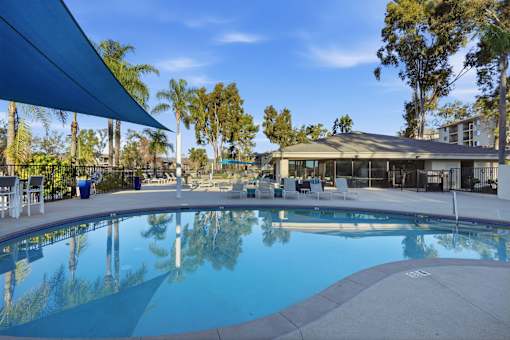 A swimming pool with a seating area