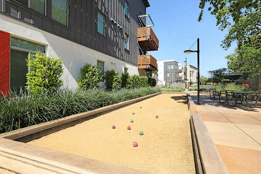 A miniature golf course with a red ball on the first hole.