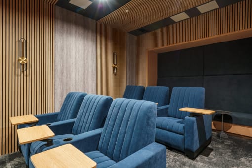 a room filled with blue chairs and tables