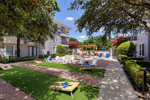 A sunny day at a residential area with a lawn and a playground.