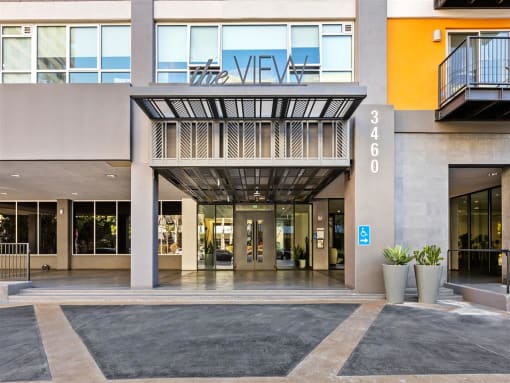 a building with a large entrance and a sign that says mexico at The View, Los Angeles, 90005