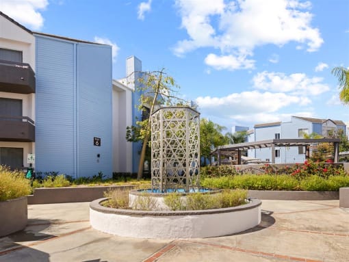 a fountain in the middle of a courtyard with buildings in the background at Enclave, California