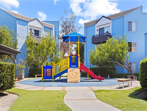 our apartments offer a playground for your little ones at Enclave, Paramount, CA 