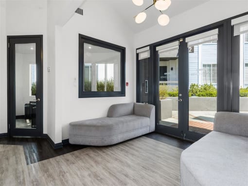 a living room with a couch and a window at Enclave, Paramount, CA 