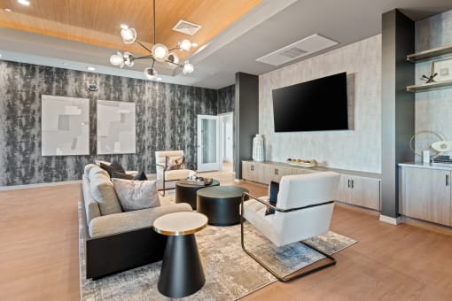 Contemporary resident lounge in neutral tones and natural light found at Cardinal 95 luxury apartments in Glendale, AZ.