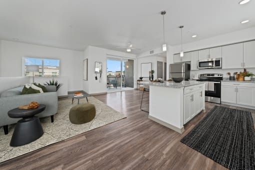 a living room with a kitchen and a dining room