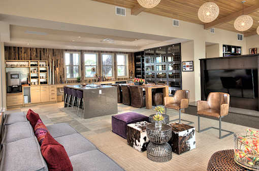 A modern living room with a grey sofa and a wooden cabinet.
