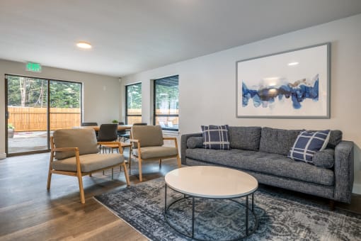 an open living room with a couch and a coffee table