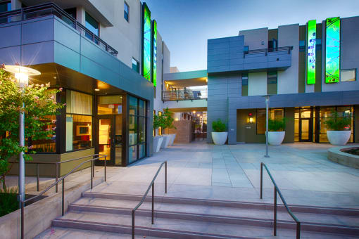 a picture of the front entrance of a building at night