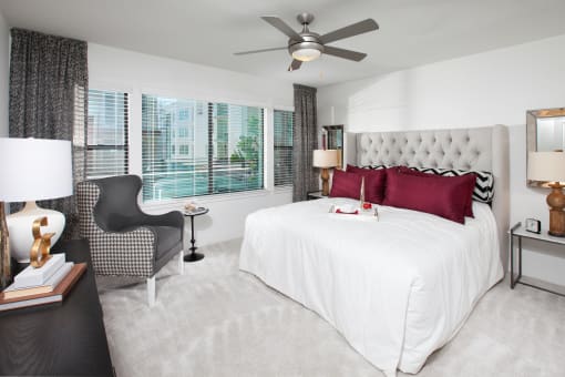 a bedroom with a bed and a chair