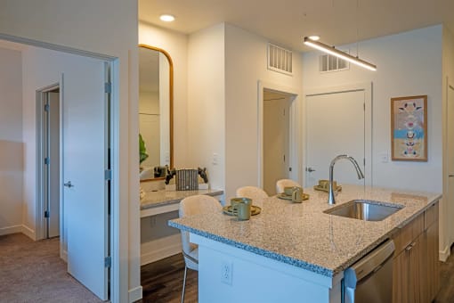 a kitchen with a granite counter top and a sink