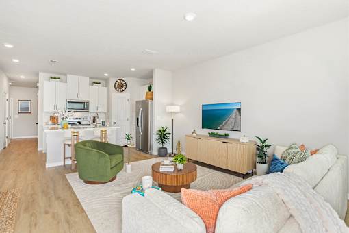A living room with a couch, chair, and a coffee table.