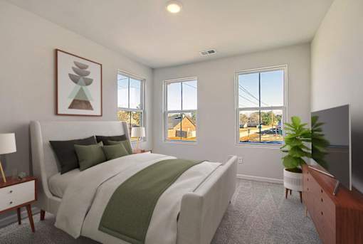 Primary bedroom with large windows