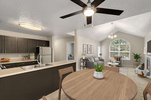 A modern kitchen with a dining table and chairs.