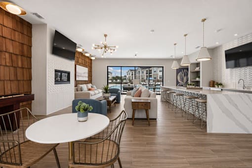 A modern living room with a white table and chairs.