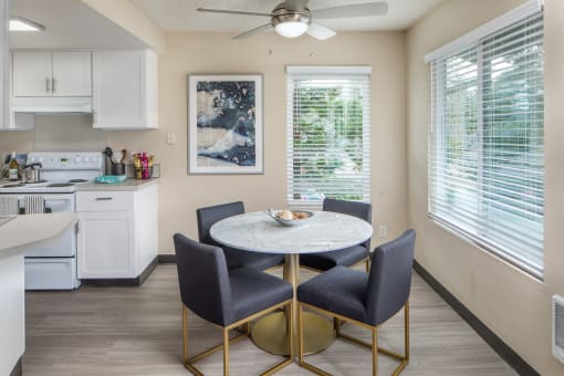 Dining room with a table and chairs and a kitchen at Summerfield, Tigard, 97224
