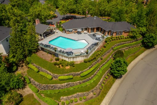 arial view of a home with a pool and manicured yard at Arbor Heights, Tigard, OR, 97224