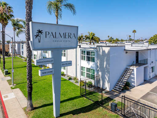 Palmera Chula Vista sign in front of a white building.