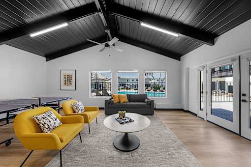 A living room with a pool view.