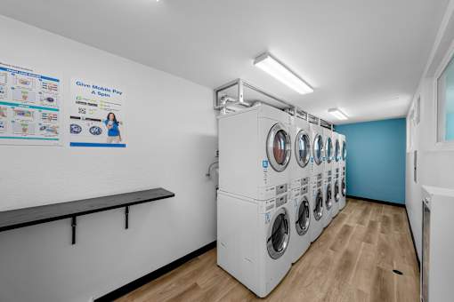 A row of washing machines in a laundromat.