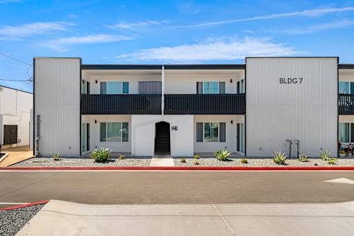 A modern building with the sign BLDG 7 on the side.