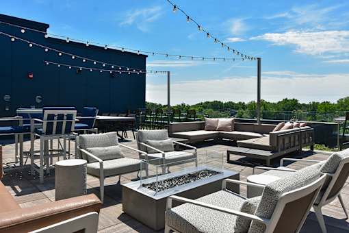 A patio with a table and chairs is set up.