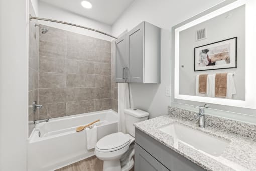 a bathroom with a sink toilet and a bath tub