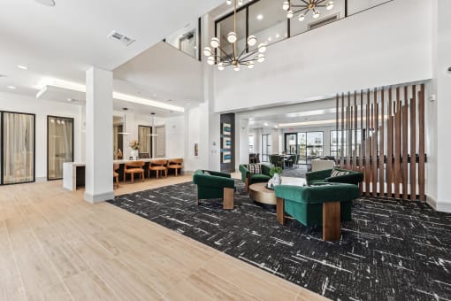 a large lobby with furniture and a large chandelier