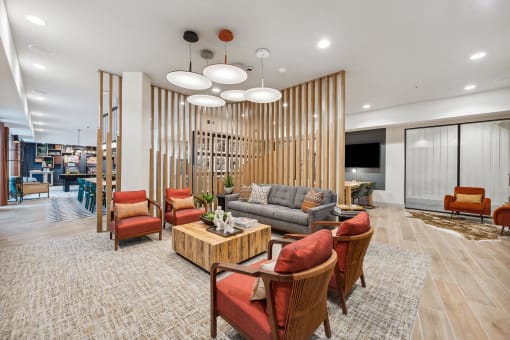 a lobby with couches chairs and a table