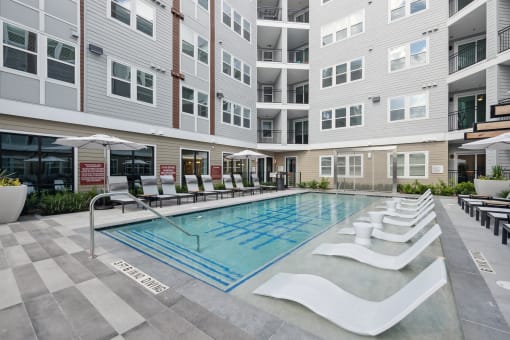 a swimming pool in the middle of an apartment building