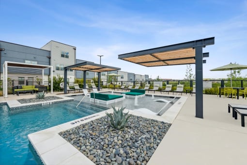 our apartments have a resort style pool with lounge chairs and umbrellas