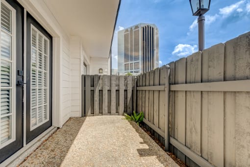 a wooden fence in front of a house