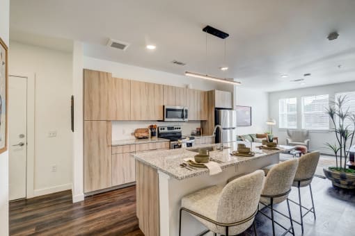 a kitchen with a bar and a dining table