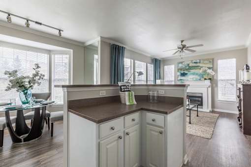 Kitchen with brown countertop at The Retreat at Fox Hollow apartments for rent in Lakewood, CO.