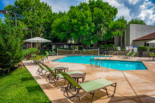 Pool surrounded by green area at Eagle Point Apartments, Albuquerque, 87111